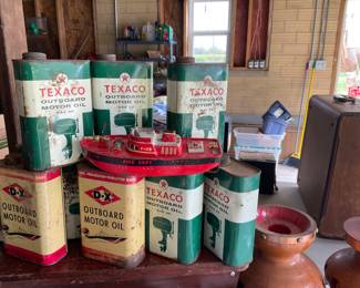 Vintage outboard motor oil cans.  