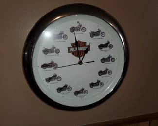 Harly Davidson Clock. There are several Bike Items. Leather Chaps, Motor Covers and a Few Parts