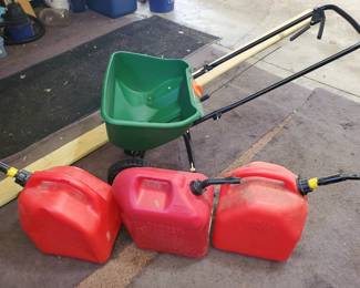 5 Galon Cans and Scotts Spreader. The Spreader is PLASTIC which makes a GREAT SALT SPREADER for Winter!