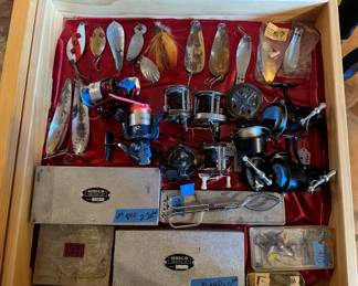 Vintage fishing lures and reels! Plus other gear is in our packed garage. "Reely awesome! lol