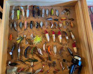 Vintage fishing lures and reels! Plus other gear is in our packed garage. "Reely awesome! lol