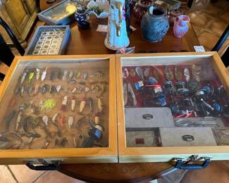 Vintage fishing lures and reels! Plus other gear is in our packed garage. "Reely awesome! lol