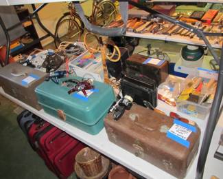More fishing gear and tackle boxes full of amazing vintage lures and other amazing items.