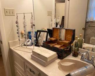Looking at the vintage jewelry boxes and bathroom items