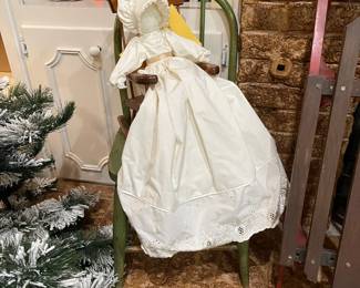 Handmade pillowcase doll sitting in a child green painted chair