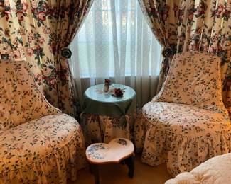 The two chairs with covers, accent table with glass top and handmade table covers, painted heart stool