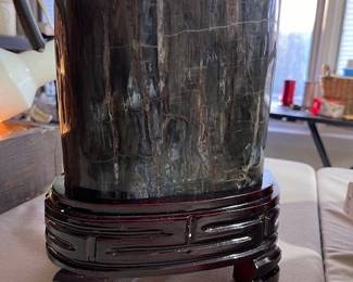 Polished petrified wood on a stand