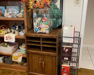 Large glass container full of match books, fall wreath