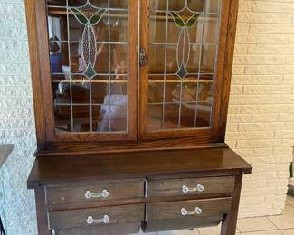 Beautiful Hoosier cabinet with leaded glass doors and flour bins with glass handles