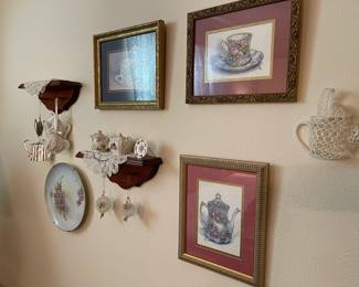 Framed art, teapot decorations, small shelves