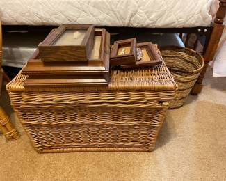 Wicker trunk, framed shell art