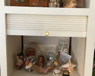 Lots of travel items, shells and owls