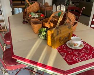 A collection of Longaberger baskets on the painted table