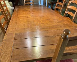 This vintage dining table has two drawer leaves and when fully extended it measures 9ft 3" and is 46" wide. The leaves are 20" long.