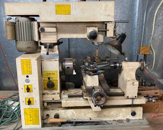 Shop-Task 1720. Someday I hope to be man enough to fiddle with equipment such as this.