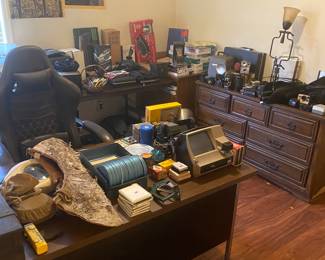 Office full of camera equipment.