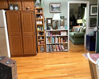 Cookbooks, art, Italian tole lamp, old coffee bin. Pottery, Buddhas. Tivoli sound system...View into den. 