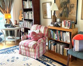 Art, books, silk rug, guitar and music & non fiction books. Plaid chair is NFS. Italian book lamp, old clock.