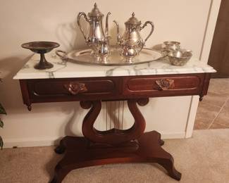 Beautiful marble top carved handle harp base side table.