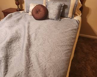 Bedding for queen bed includes comforter, pillows and shams