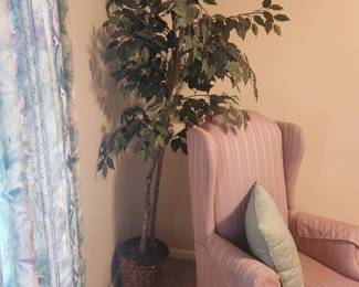 Two of two pink wing back chairs.