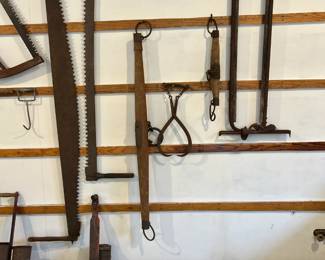 Saws,  ox yokes (x3), barn stantion