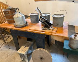 Butter churn, poultry feeder, grindstone, minnow pails, clay target launcher