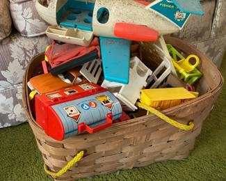 A multitude of Fisher Price toys