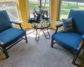 Two blue fabric arm chairs