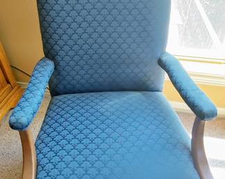 Two blue fabric arm chairs