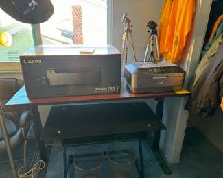 Computer desks including standing adjustable desk