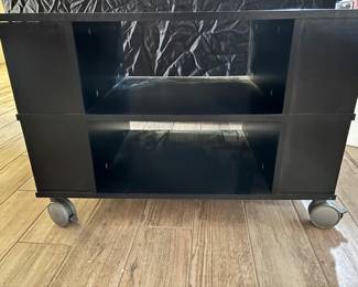 Black media stand- 
19’ deep
31.5’ wide
22’ high 