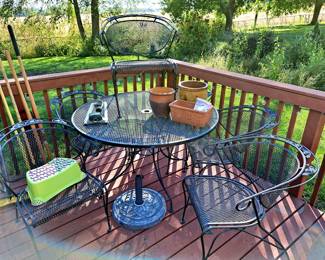 7 pcs. Wrought iron table w/ 6 chairs and umbrella base