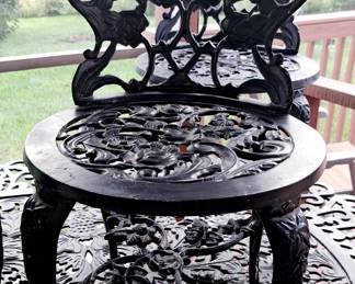 One of four Rose chairs has fancy rose bottom brace