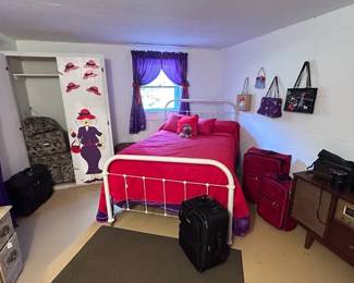 Down to the basement where you'll find the red hat lady room furniture luggage antique stoves and more