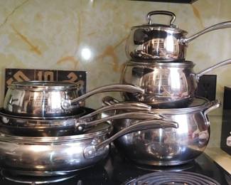 12 piece set of stainless steel Biltmore cookware set that includes lids for each. 
, five pots with lids and two skillets