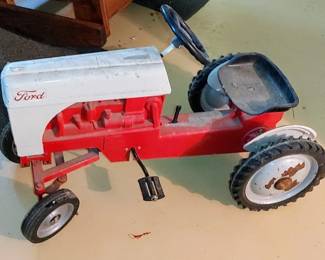 Vintage peddle tractor looks like the old tractor in the barn
