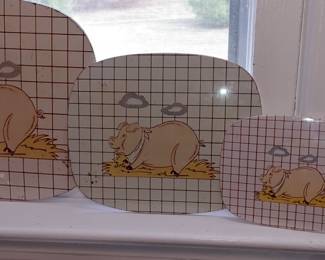 Vintage metal hot plates with pigs