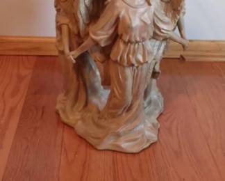 One of a kind Angel End Tables. Three gorgeous angels holding hands and frolicking in the summer sun, carelessly dancing away the afternoon. Intricate details on faces, wings and gowns make this an exceptional piece. Cast in fiberglass resin in a ANTIQUE STONE finish Ogee edge finish on round 3/8” thick 24" diameter glass top.