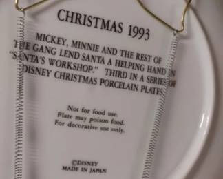 Back side Disney Collector plate.