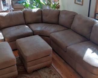 Aniline leather sectional with matching ottomans. 3 sections each measuring apx 60" x 39". Decorative nice nail heads. Only the highest quality Full Grain Leather can receive an Aniline Finish. Good used condition. Very comfortable. Smoke Free Home.
