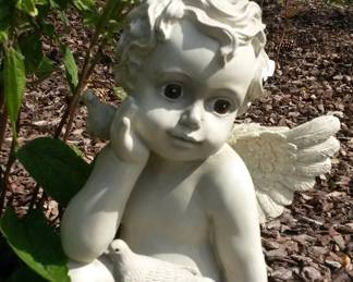 Cherub garden statue with doves.