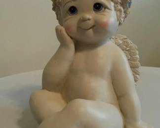 Petite cherub garden statue.