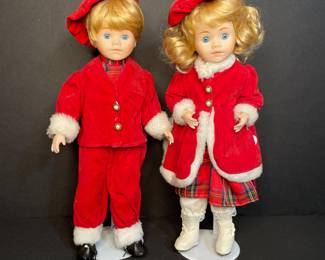 Vintage porcelain boy girl holiday dolls on stand 
