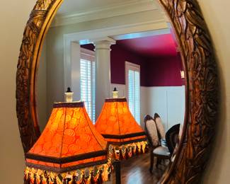 Carved wood framed oval mirror