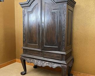 Antique Dutch Colonial Bonnet Top Mahogany Storage Cabinet w/ Ornate Carvings. Two Lower Drawers and Apron