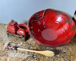 Large red serving bowl with salad tongs and cream and sugar set