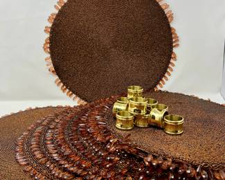  Exotic Decor Lot -Eight Round Beaded Placemats, & Ten Brass Napkin Rings
