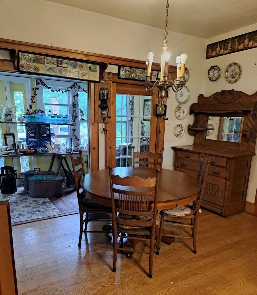 Oak table pulled out can sit 12 has 4 chairs. Hutch