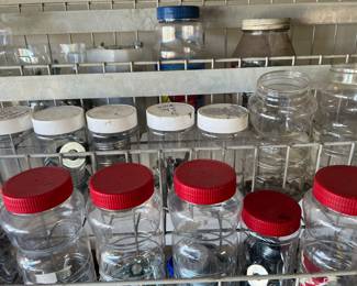 Jars full of miscellaneous nuts, bolts, screws, washers, nails, etc.